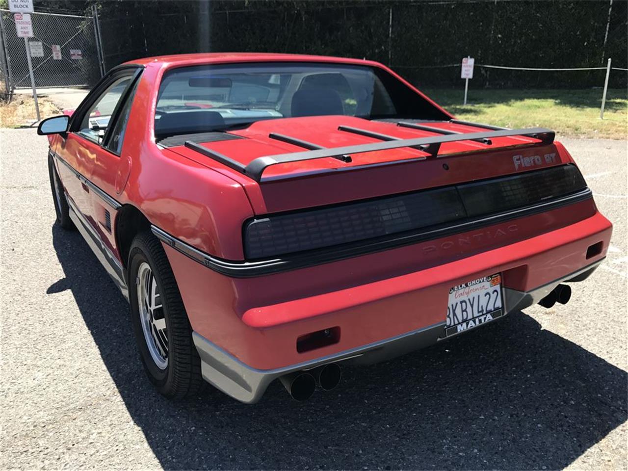 A 1985 Pontiac Fiero econo-commuter in a Northern California wrecking yard.