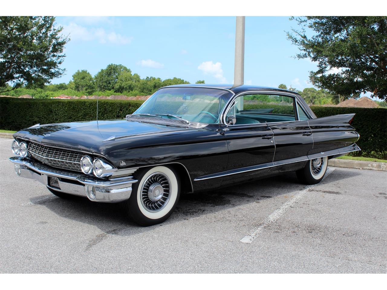 https://photos.classiccars.com/cc-temp/listing/111/4469/12703394-1961-cadillac-deville-std.jpg