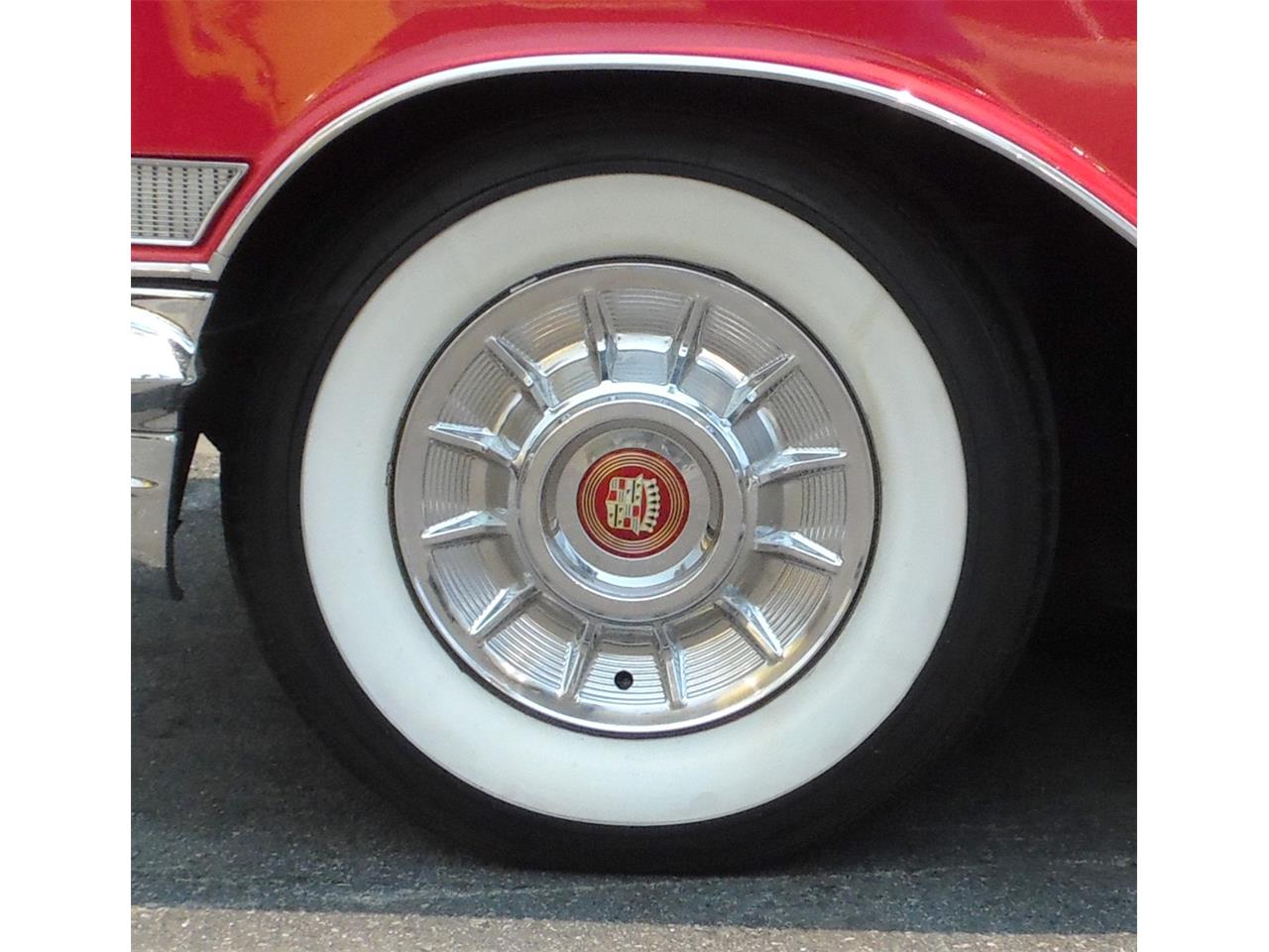 57 caddy hubcaps