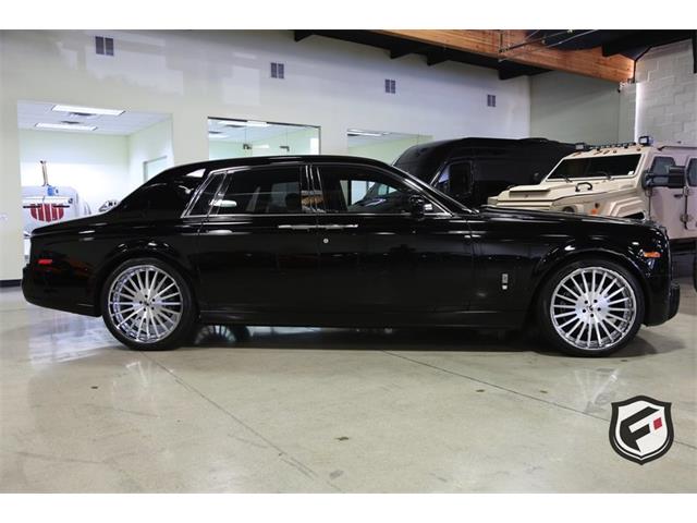 The Rolls-Royce Phantom has a Teflon-coated umbrella in the rear