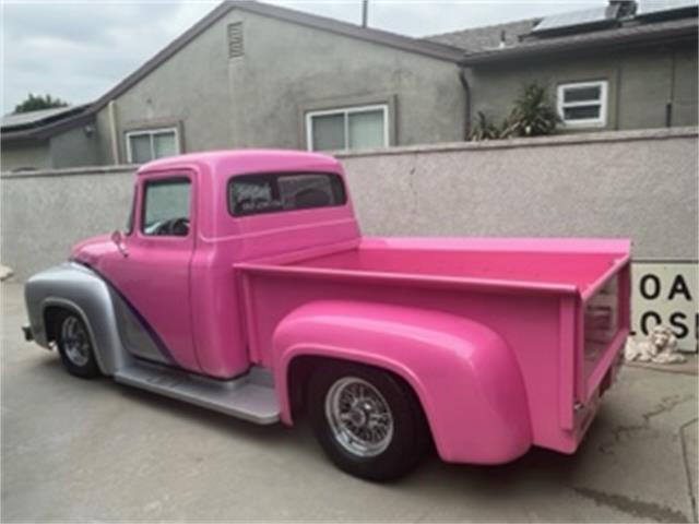 Pink Ford Truck in a Parking Lot