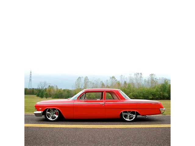 1962 Plymouth Belvedere four-door sedan finished in white with red interior