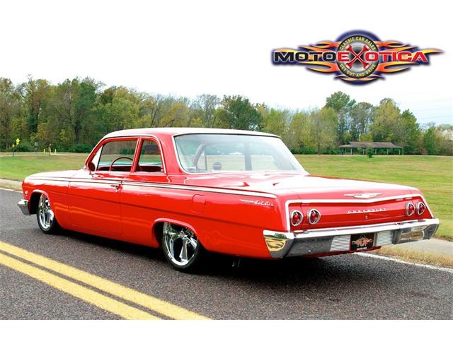 1962 Plymouth Belvedere four-door sedan finished in white with red interior